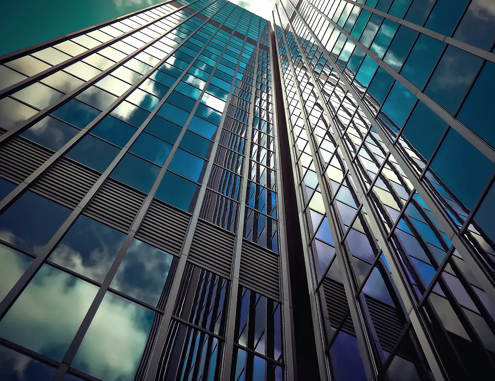 Glass commercial tower seen from below