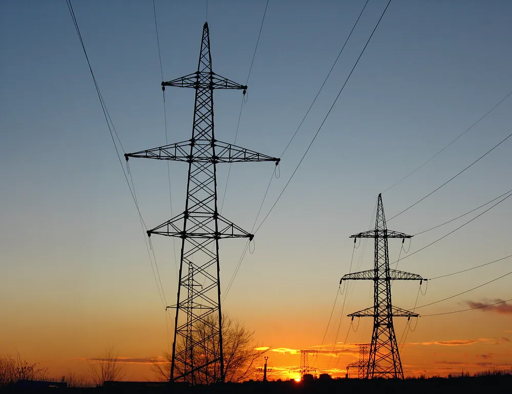 Power transmission towers at sunset